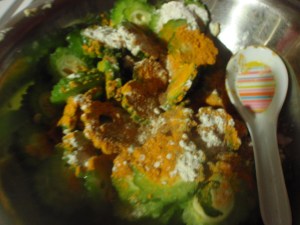 Marinade the bitter melon in turmeric, salt, chilli powder.